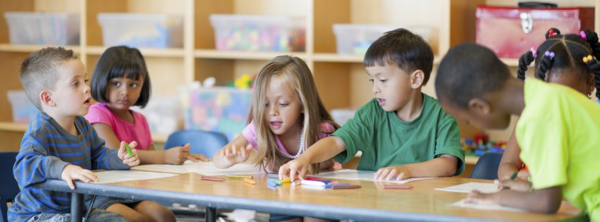 A diverse group of preschoolers in a classroom